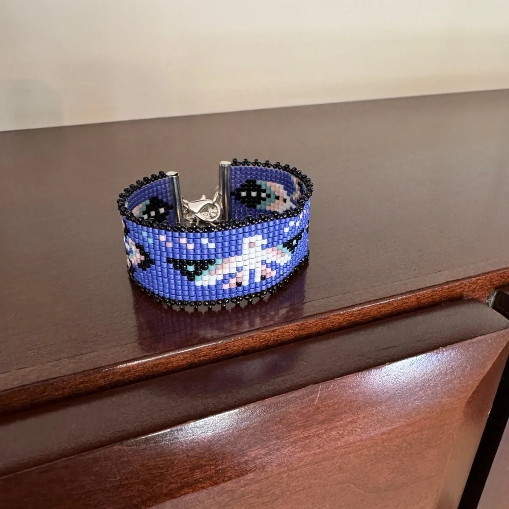 Hand crafted Adjustable Beaded Bracelet with Thunderbird and charms